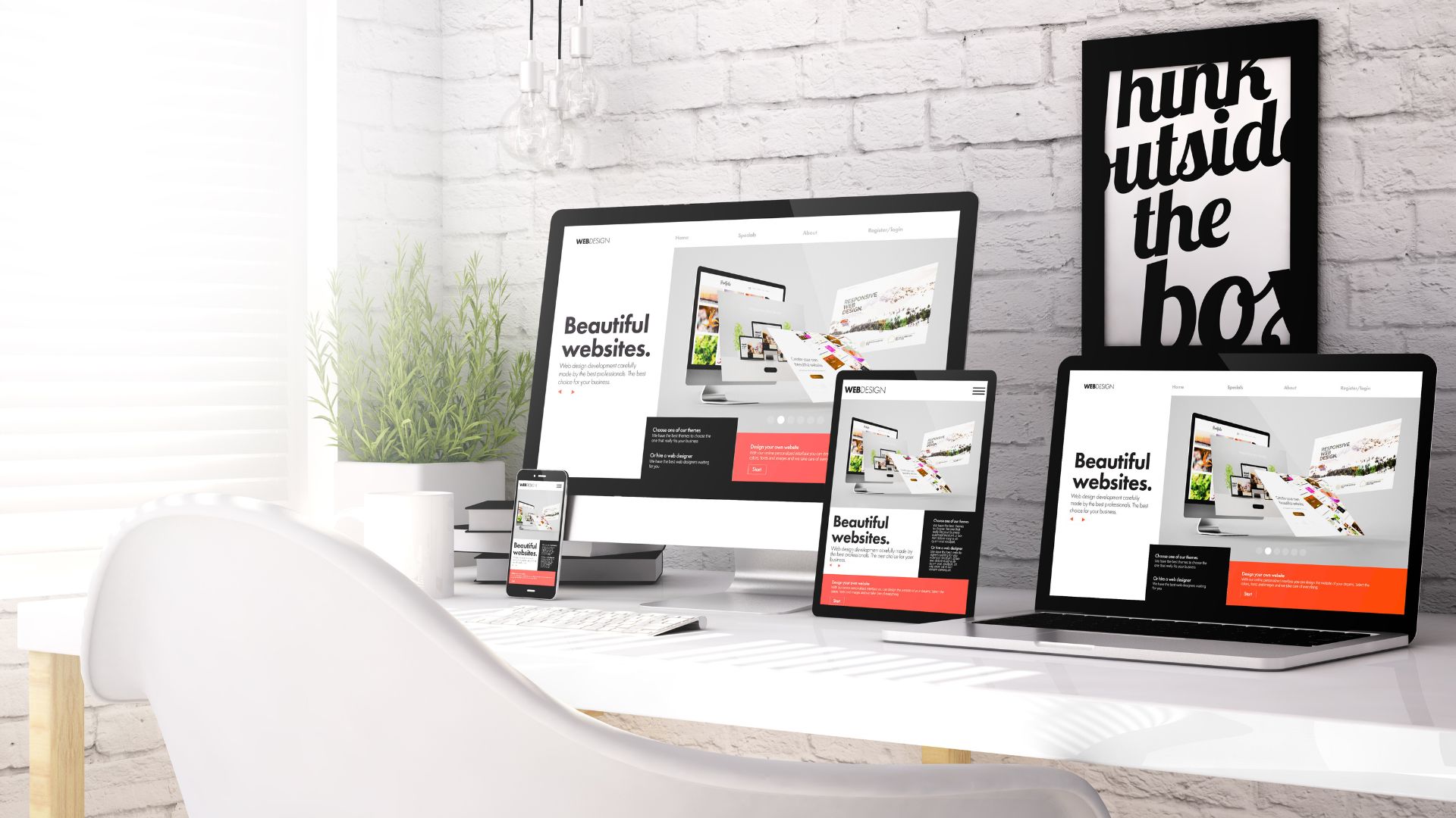 Modern workspace with web design shown on all devices