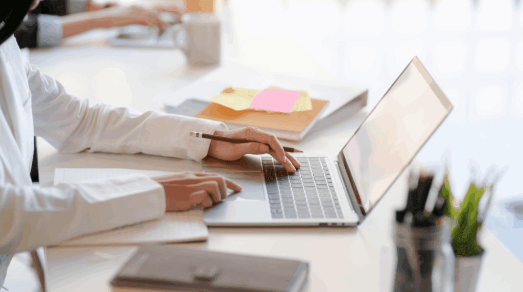 person typing on laptop