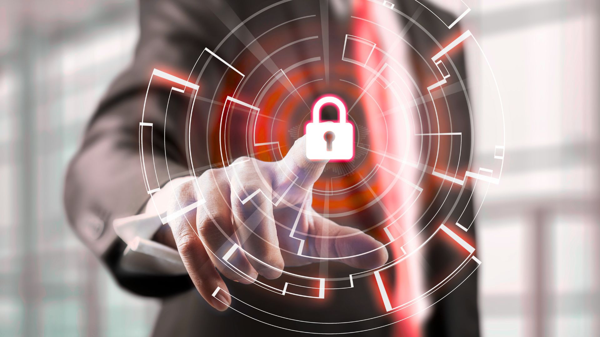 Business person pointing at a glowing digital padlock on a transparent touchscreen interface, representing cybersecurity or website protection.
