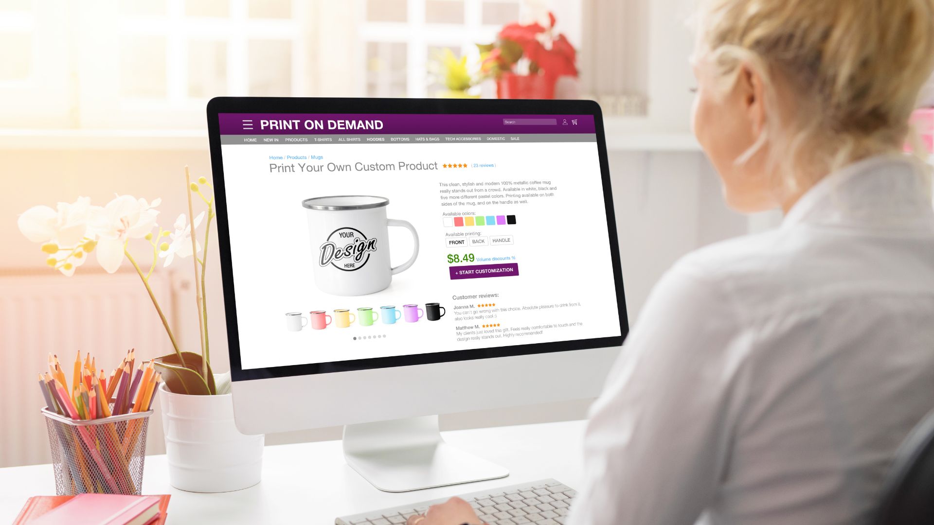  Woman using a computer to design custom products, representing unoptimised product images on ecommerce websites.