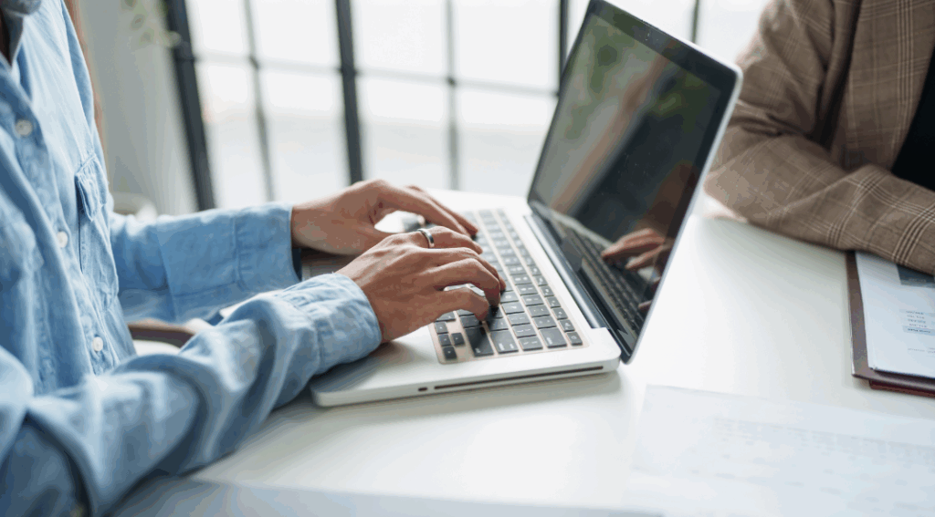 typing on laptop